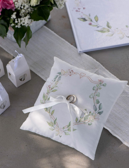 Coussin d'alliances motif végétal pour mariage blanc avec feuilles vertes