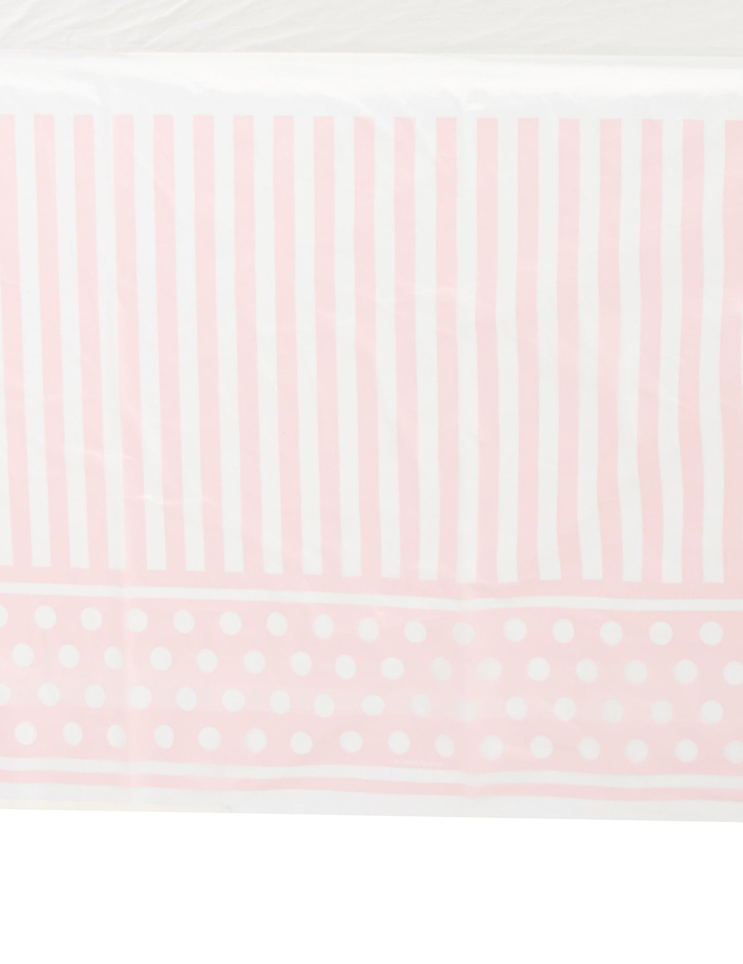 Détail des motifs de la nappe en plastique rayé et à pois pour fête rose et blanc