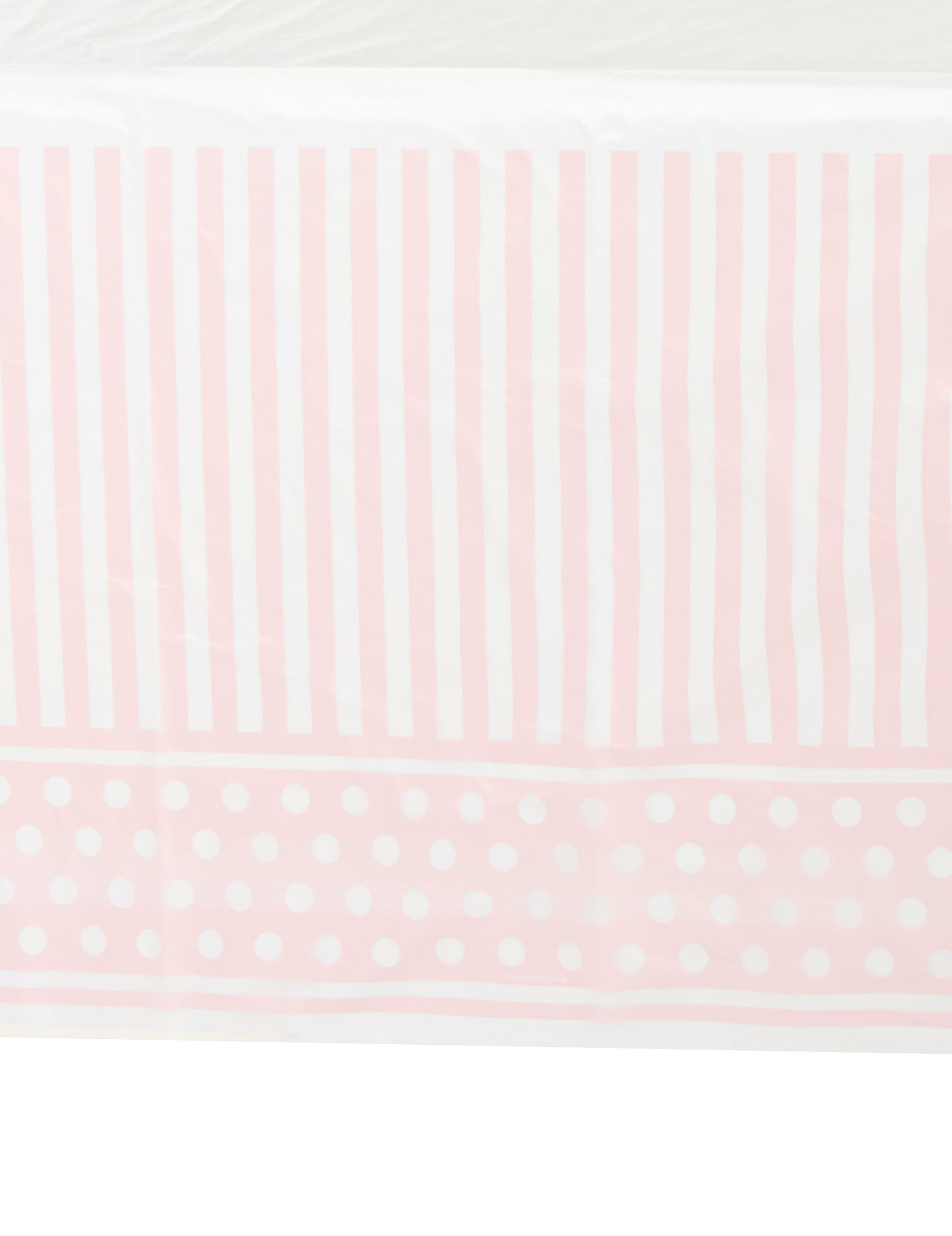 Détail des motifs de la nappe en plastique rayé et à pois pour fête rose et blanc