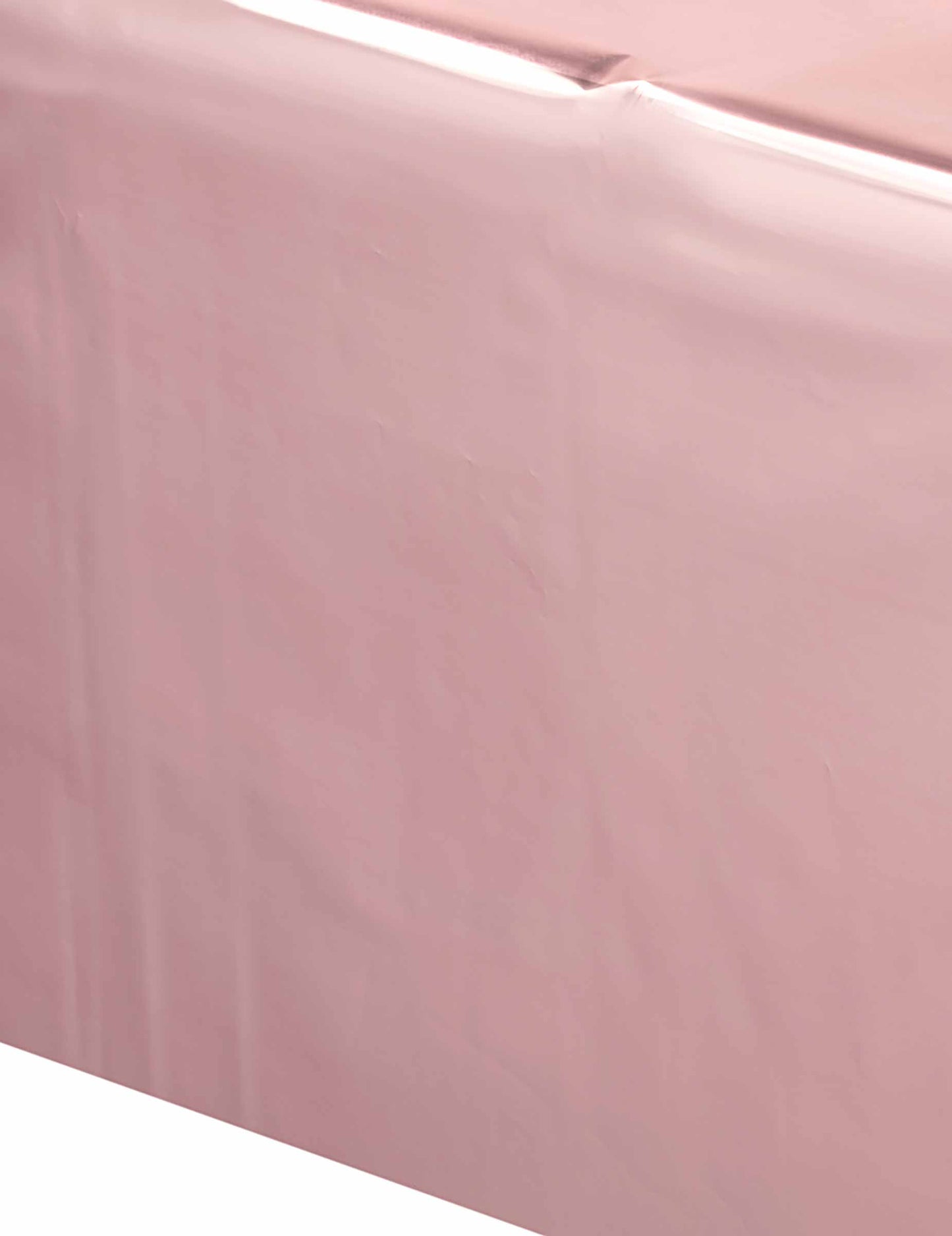 Gros plan sur la matière de la nappe en plastique rose gold pour fête
