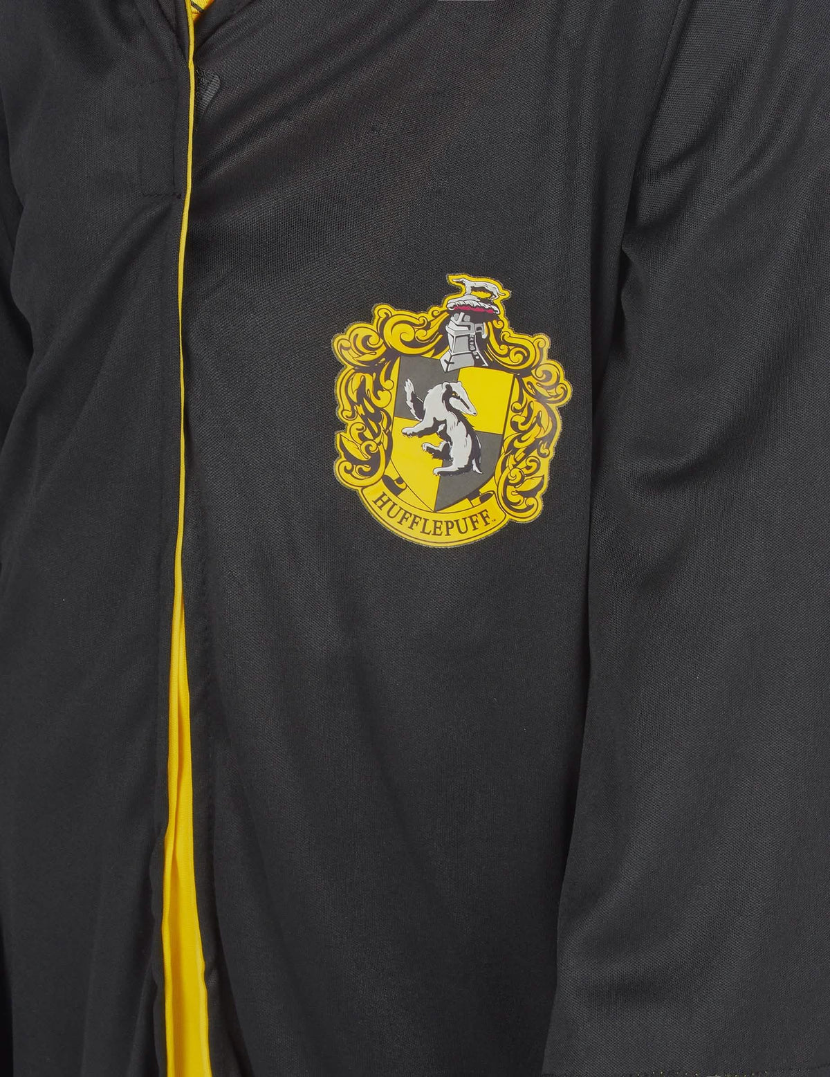 Detalj grba klasičnog kostima Hufflepuff Harry Potter™ za dijete