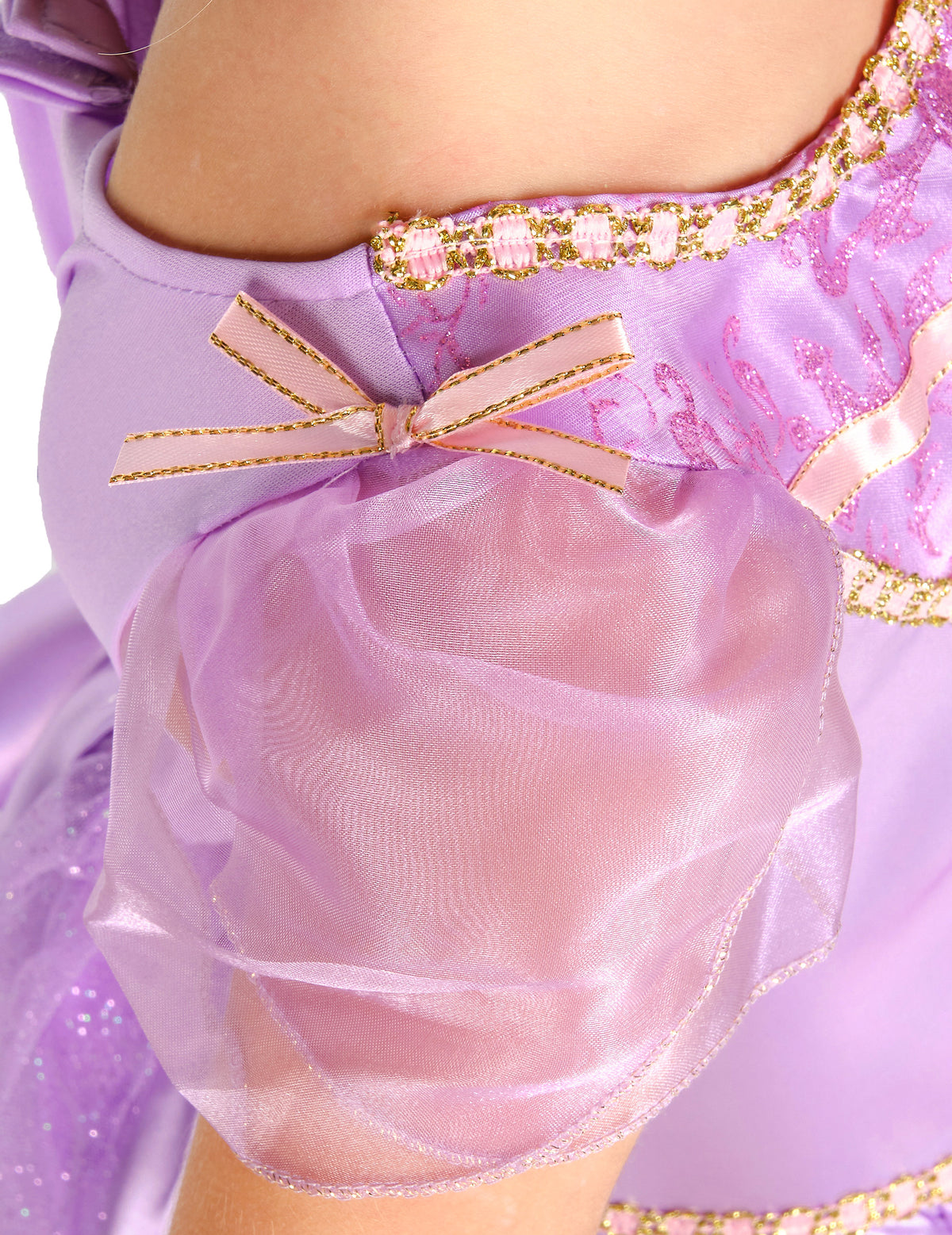 Détail de la manche bouffante et du nœud rose du déguisement deluxe Raiponce™ pour fille