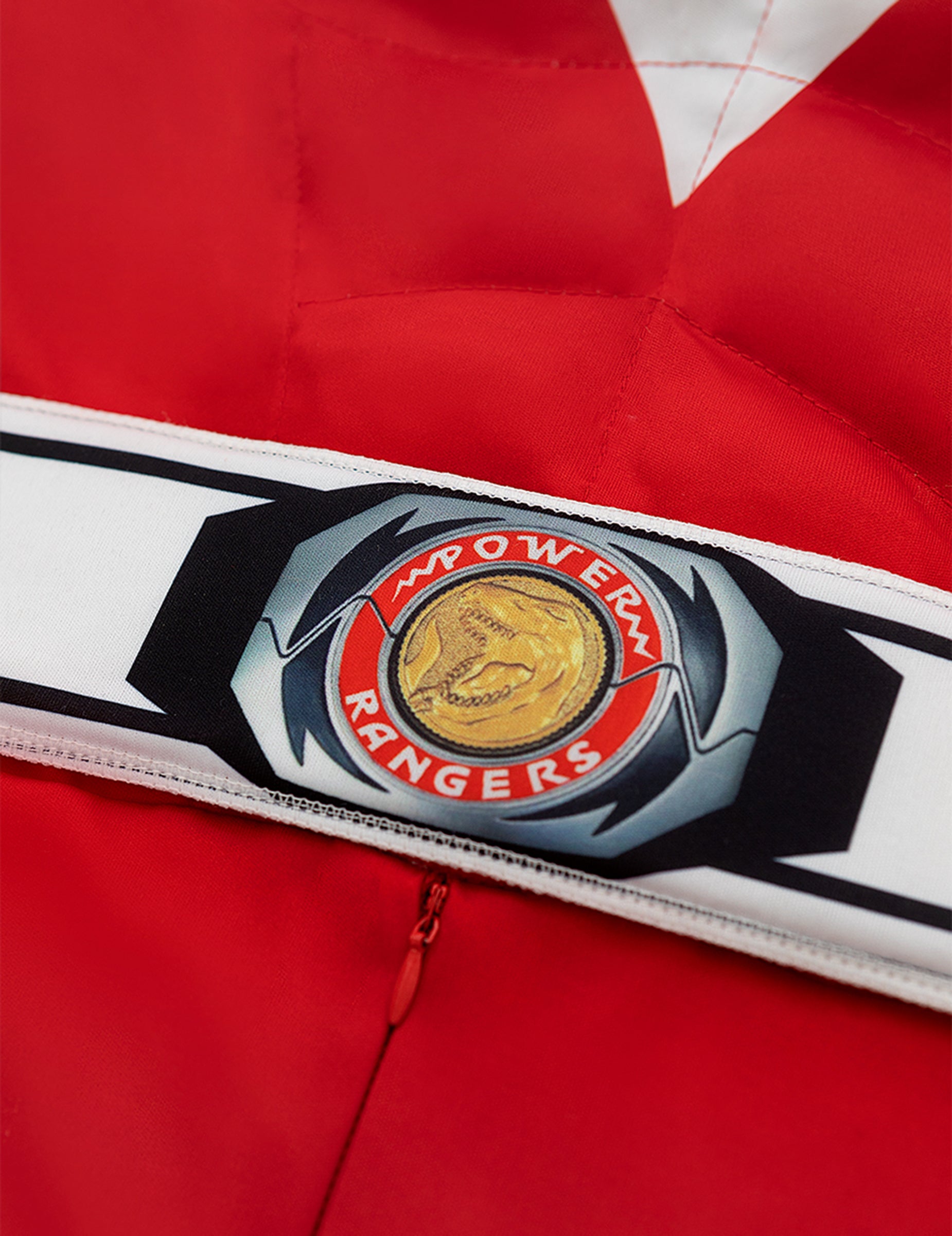 Détail de la boucle de ceinture du déguisement Power Ranger rouge musclé