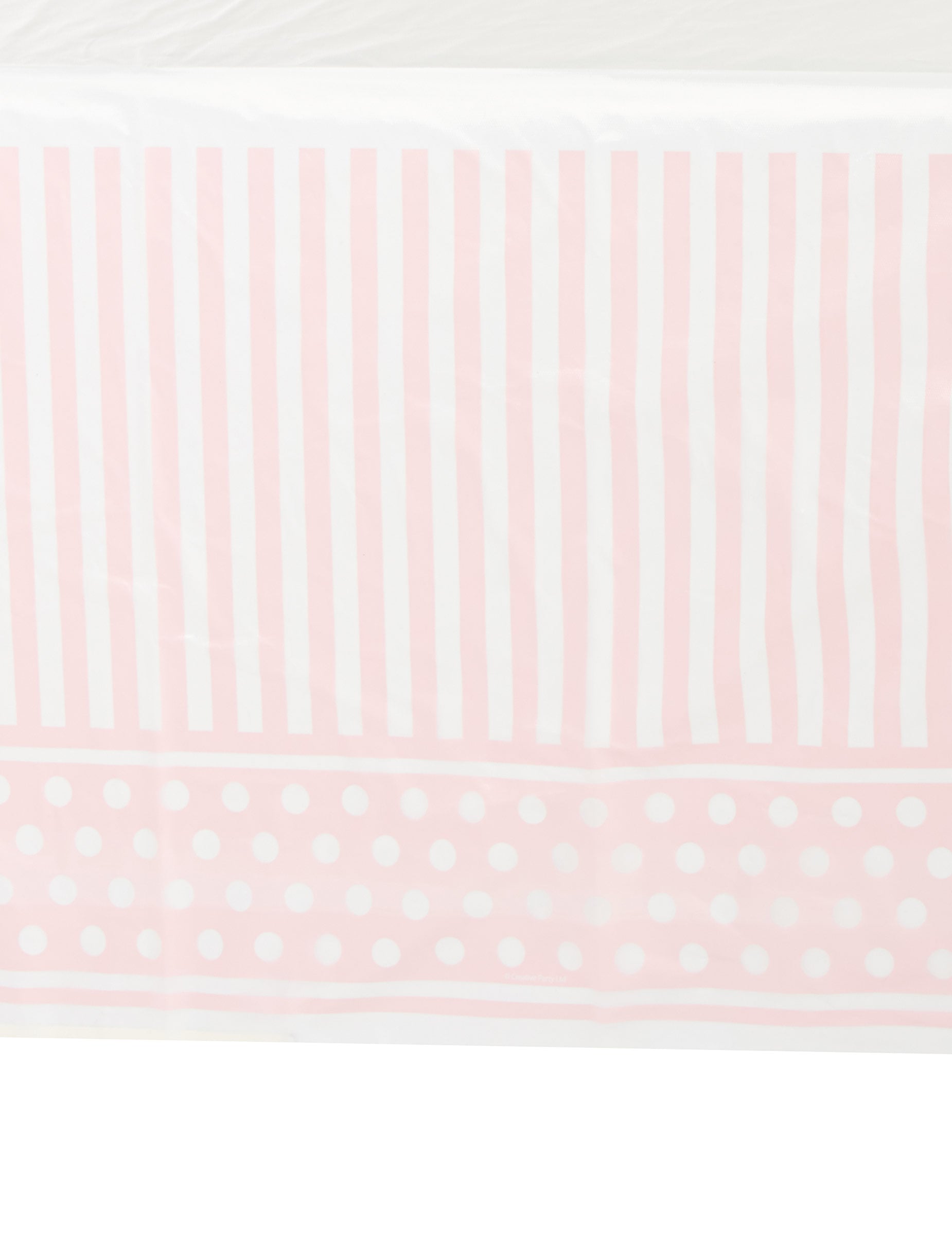 Détail des motifs de la nappe en plastique rayé et à pois pour fête rose et blanc