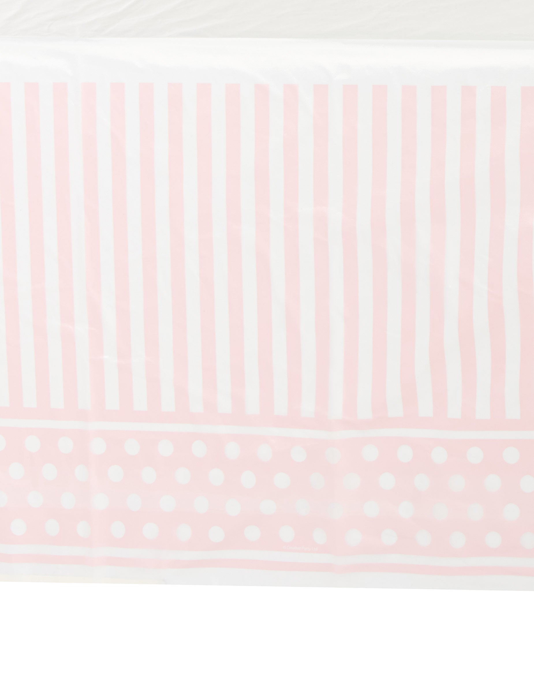 Détail des motifs de la nappe en plastique rayé et à pois pour fête rose et blanc