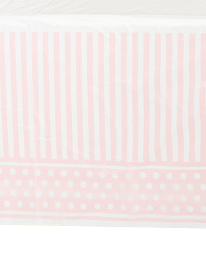 Détail des motifs de la nappe en plastique rayé et à pois pour fête rose et blanc