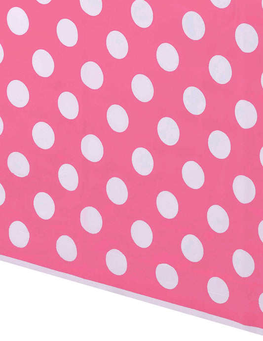 Détail du motif de la nappe plastique à pois rose et blanc