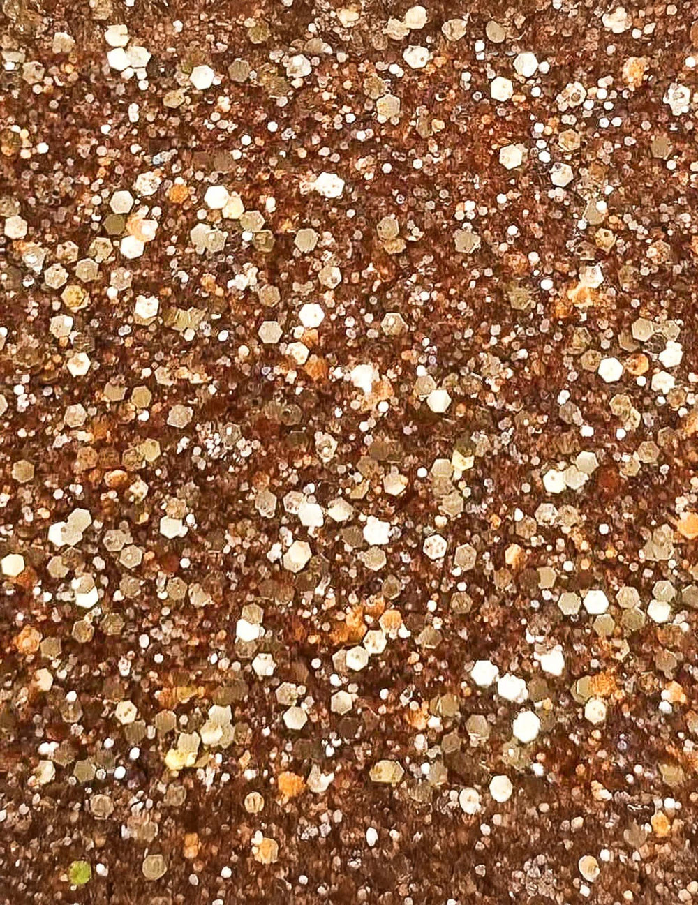 Gros plan sur la texture des paillettes biodégradables Si si la paillette pour maquillage orange métallique